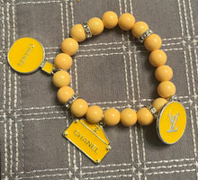 Load image into Gallery viewer, Yellow &amp; gold designer inspired beaded bracelets set of 2
